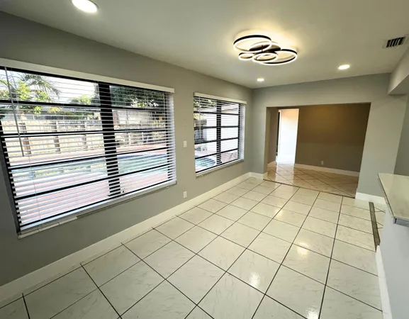 a view of an empty room and window