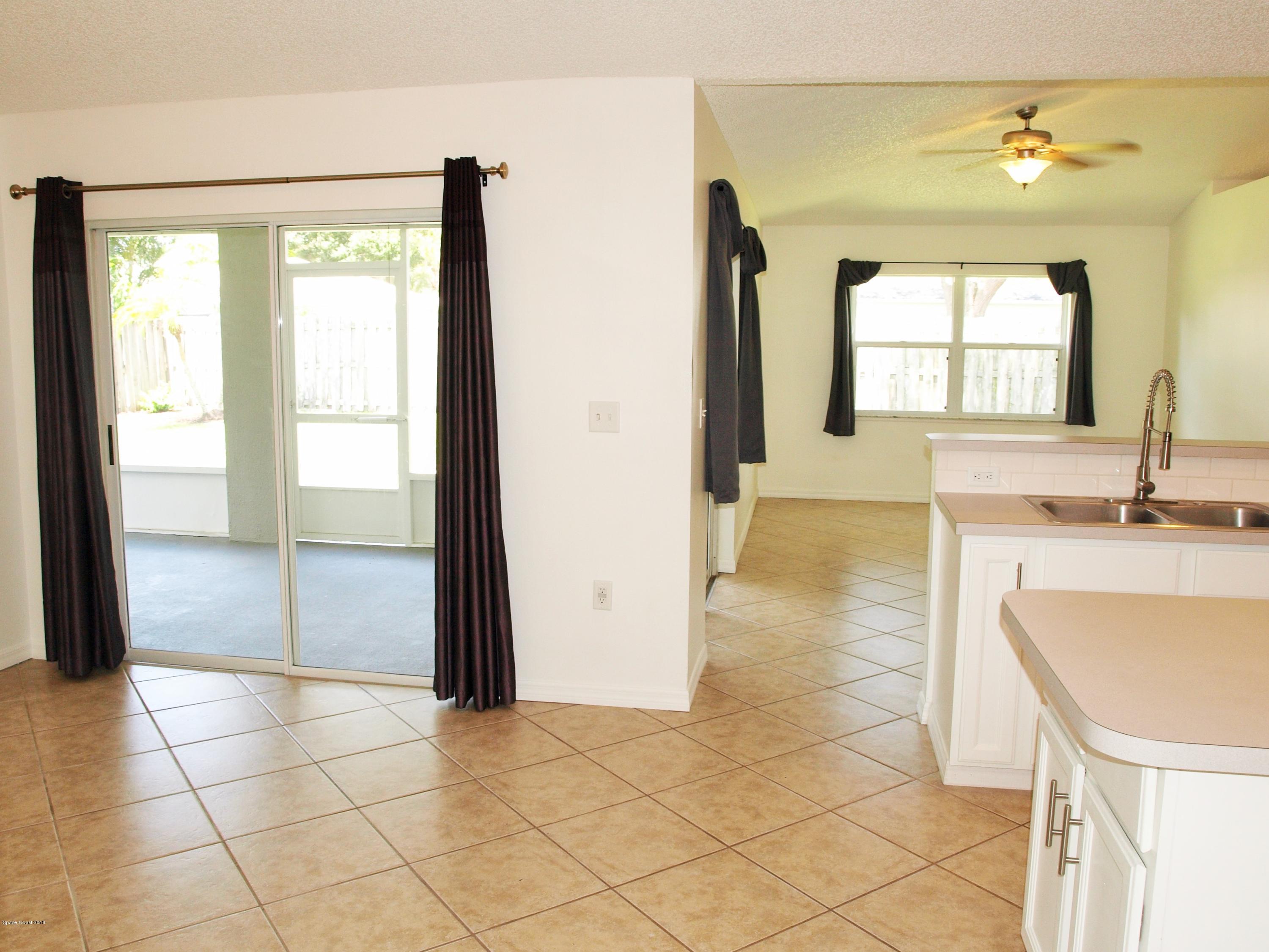 218 Twin Lakes Road Melbourne, FL 32901 - Photo 5 of 32 Dining Looking Thru to Family Room