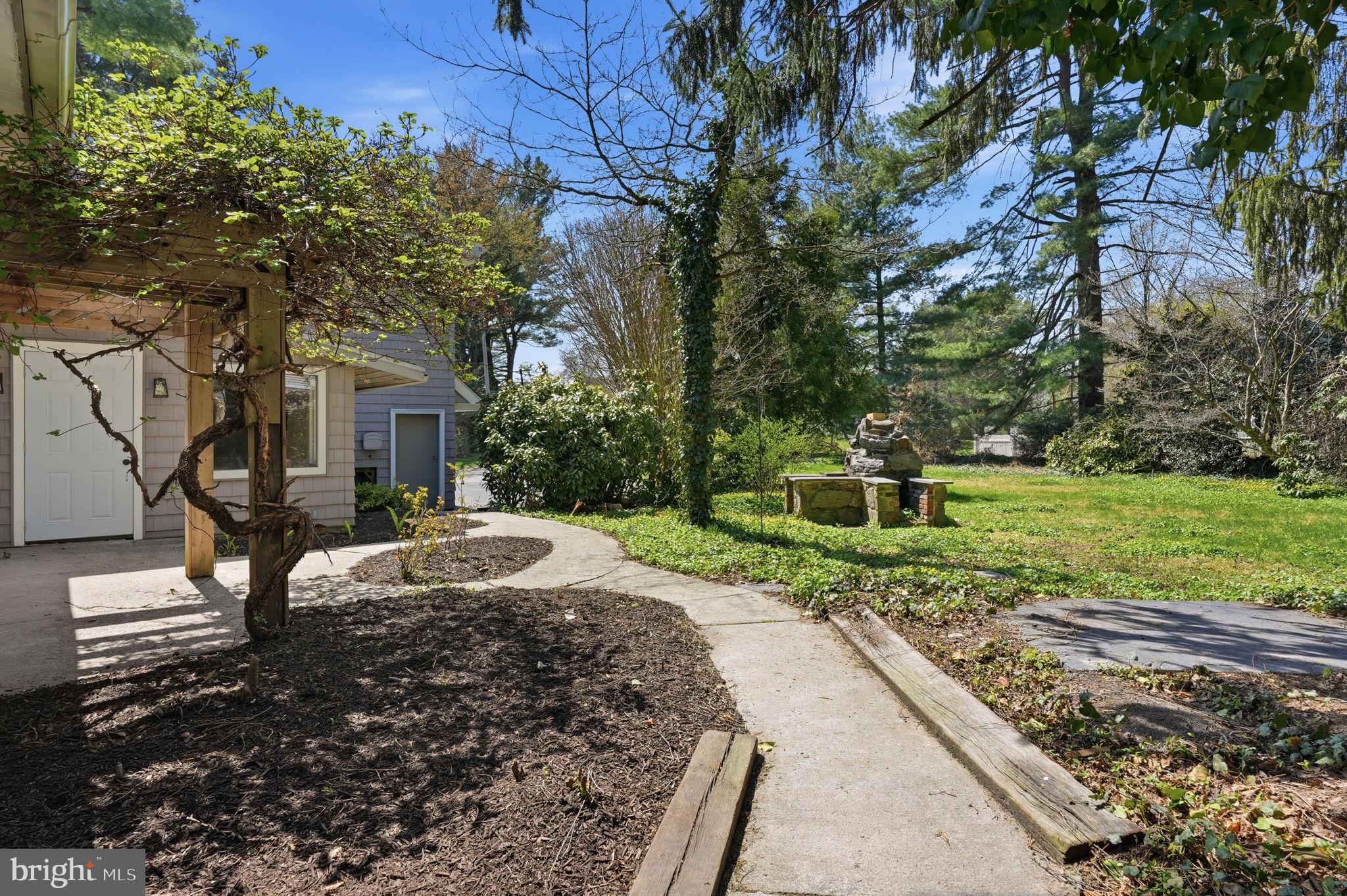 409 South Providence Road Wallingford, PA 19086 - Photo 10 of 106 Serene garden path invites exploration.