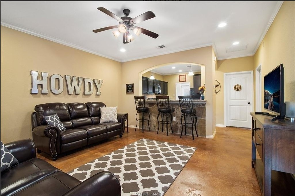 3201 Corporal Road College Station, TX 77845 - Photo 2 of 10 a living room with furniture and a flat screen tv