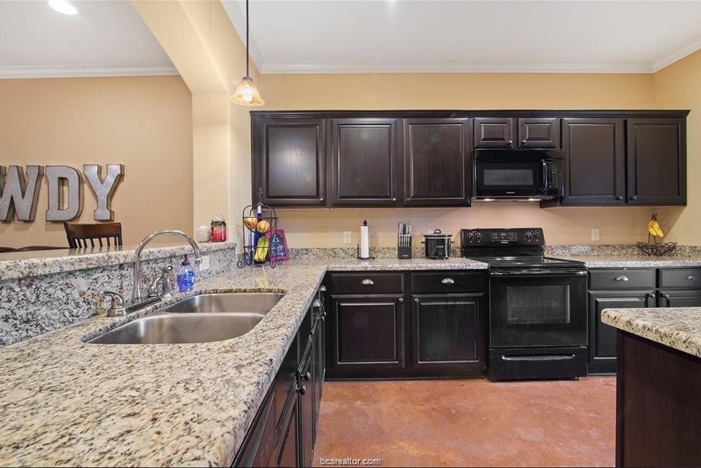 3201 Corporal Road College Station, TX 77845 - Photo 4 of 10 a kitchen with a sink stove and cabinets