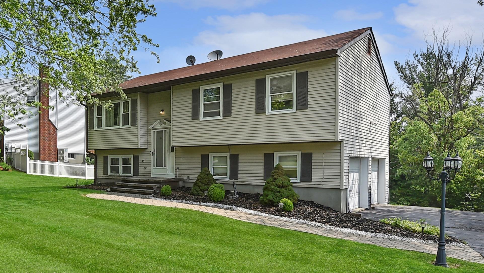 16 Beth Drive Middletown, NY 10941 - Photo 1 of 1 a front view of a house with a garden