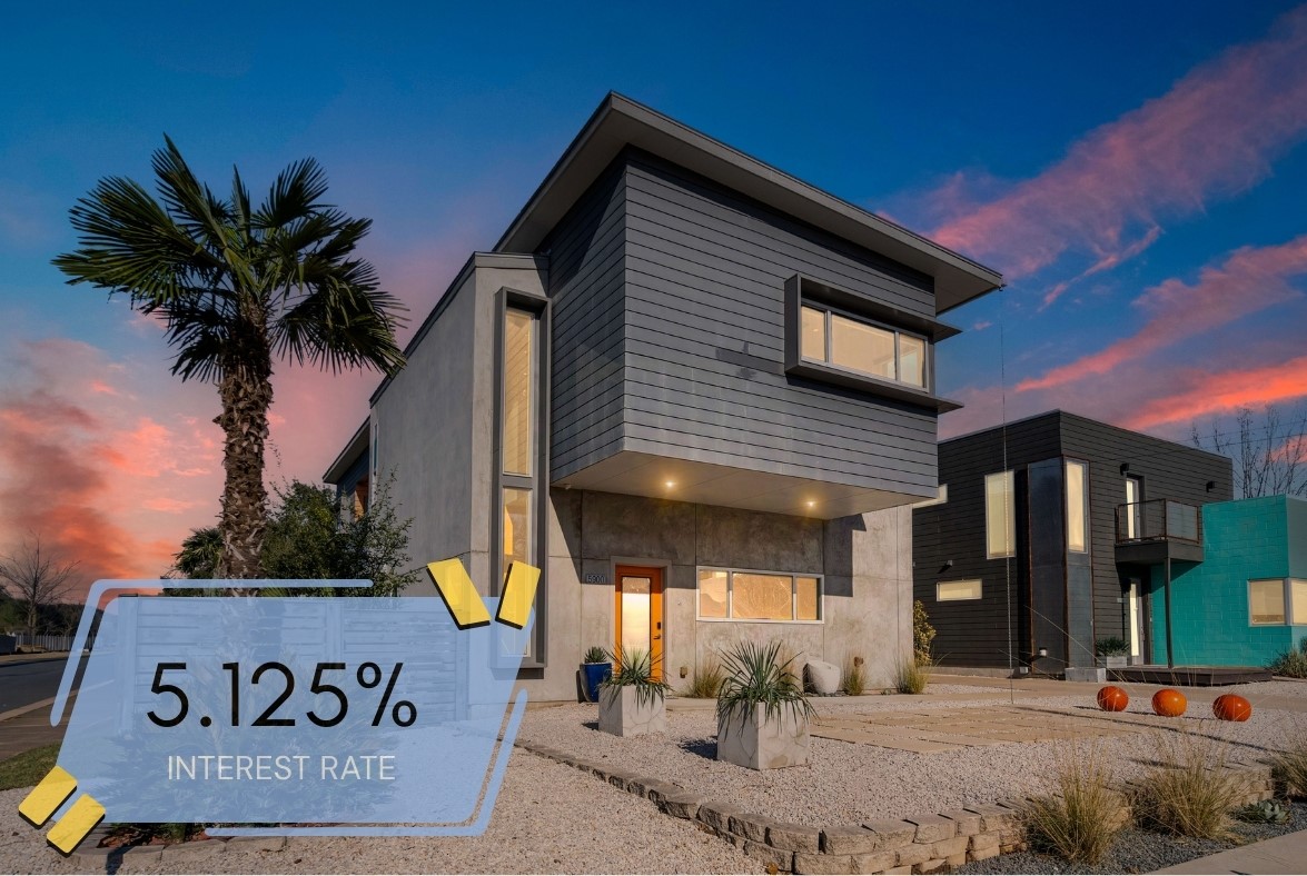 a view of a house with a potted plant and a sign on the wall