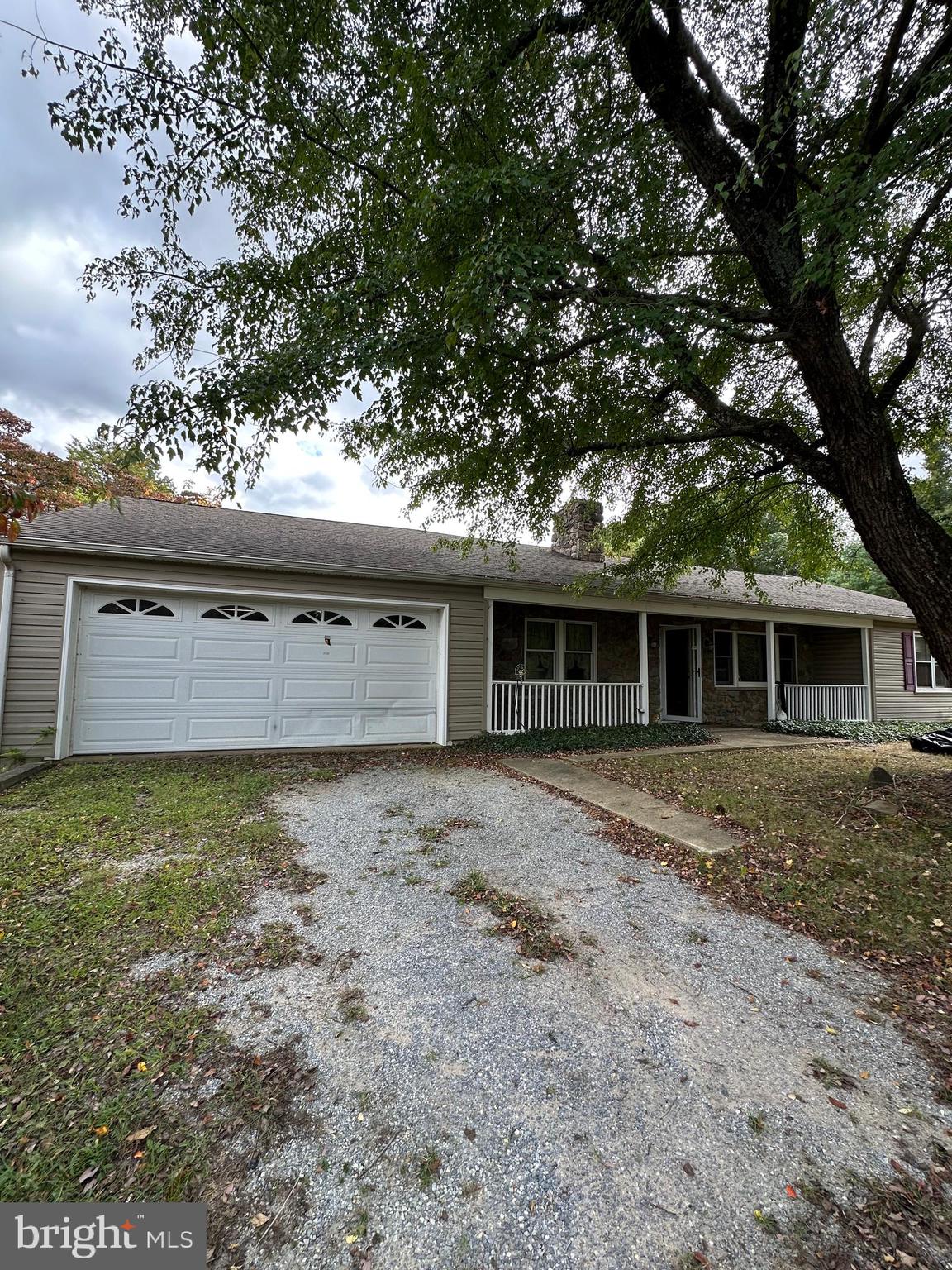 a view of a house with large tree