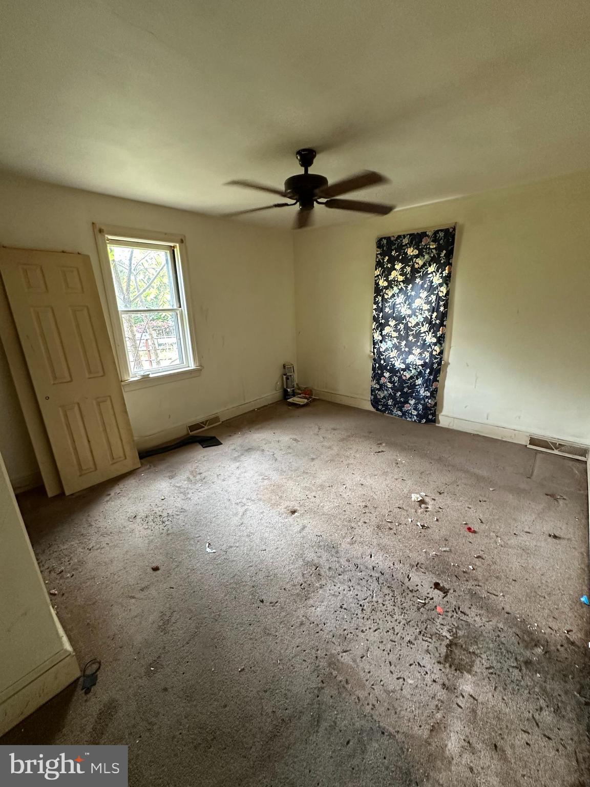 2324 Oldfield Point Road Elkton, MD 21921 - Photo 22 of 40 an empty room with windows and fan