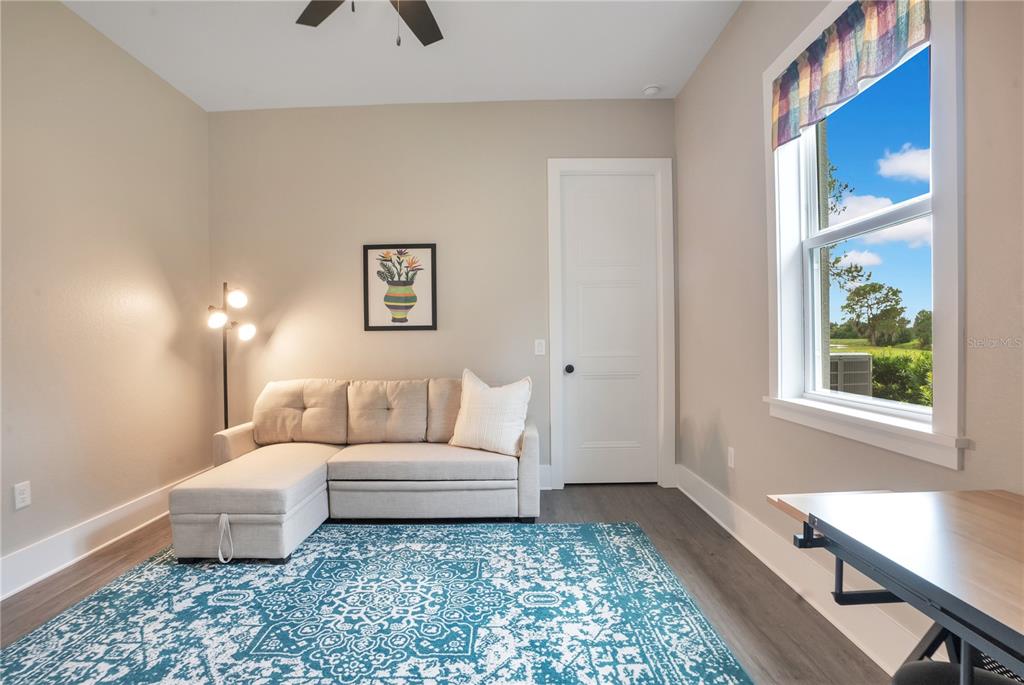 440 Palma Ceia Road Winter Haven, FL 33884 - Photo 45 of 78 a living room with furniture and a rug