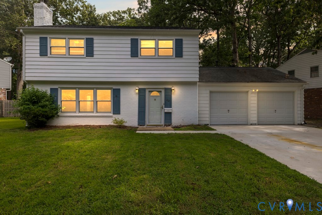 207 Missionary Ridge Hampton, VA 23669 - Photo 2 of 32 White siding exterior with a two-car garage, concr
