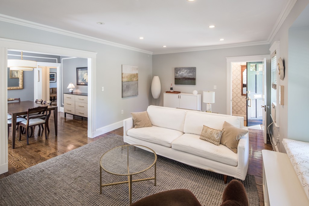 a living room with furniture a dining table and a piano table