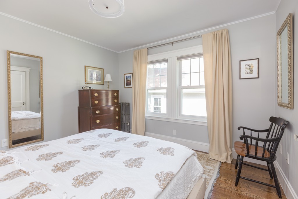32 Skahan Road, Unit 32 Belmont, MA 02478 - Photo 11 of 18 a bedroom with a bed and a chair