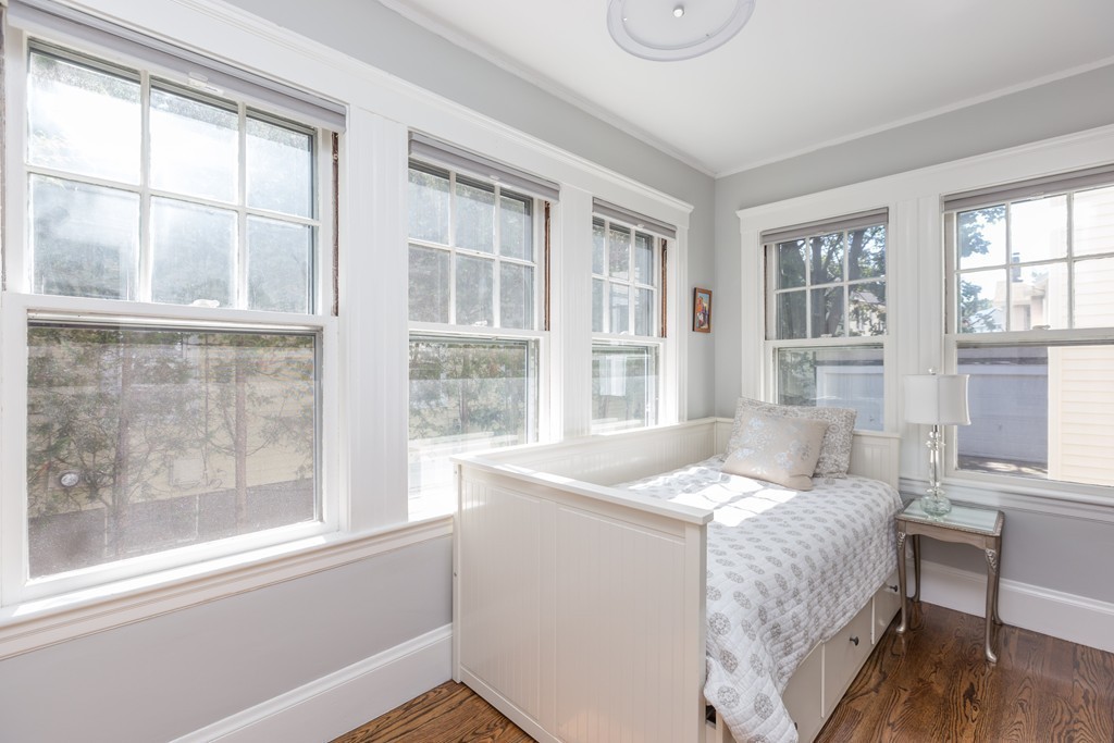32 Skahan Road, Unit 32 Belmont, MA 02478 - Photo 13 of 18 a bedroom with a bed and wooden floor
