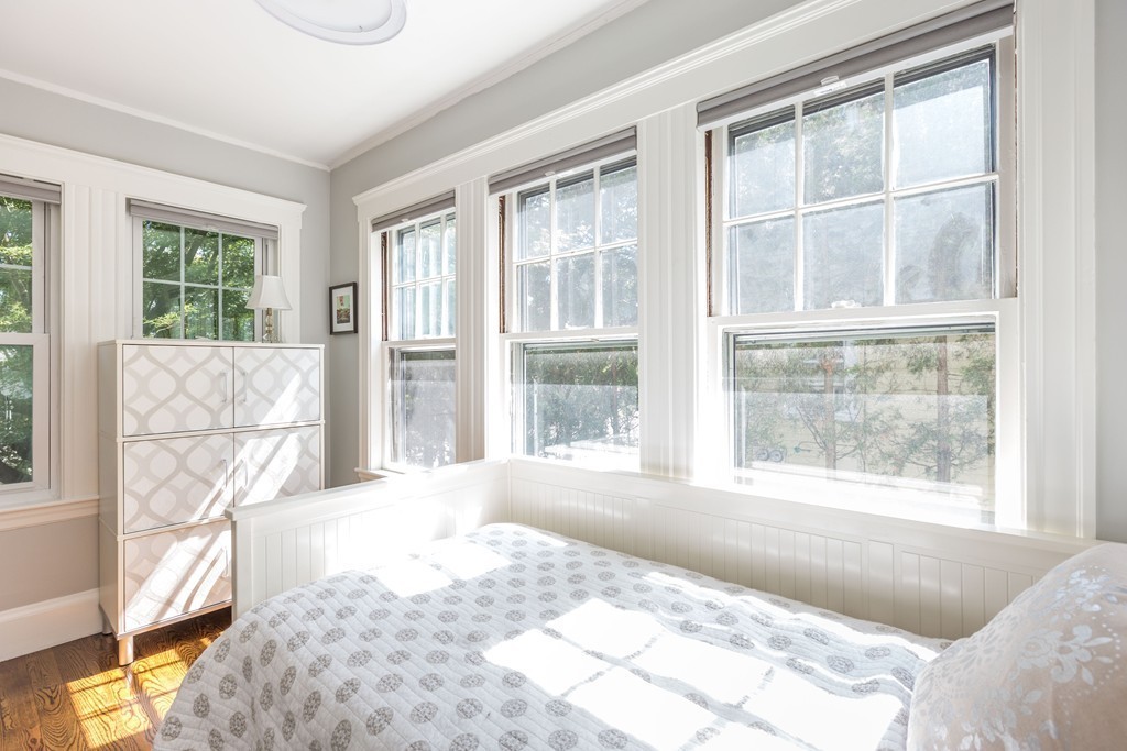 32 Skahan Road, Unit 32 Belmont, MA 02478 - Photo 14 of 18 a bed sitting in a bedroom next to a window