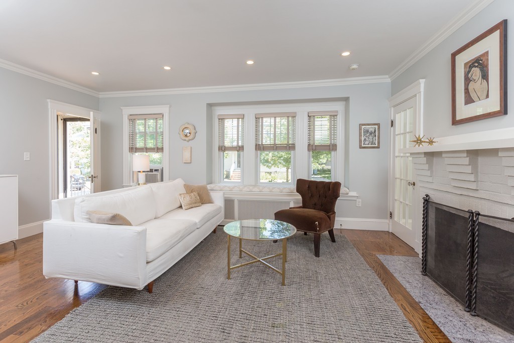 32 Skahan Road, Unit 32 Belmont, MA 02478 - Photo 3 of 18 a living room with furniture and a fireplace