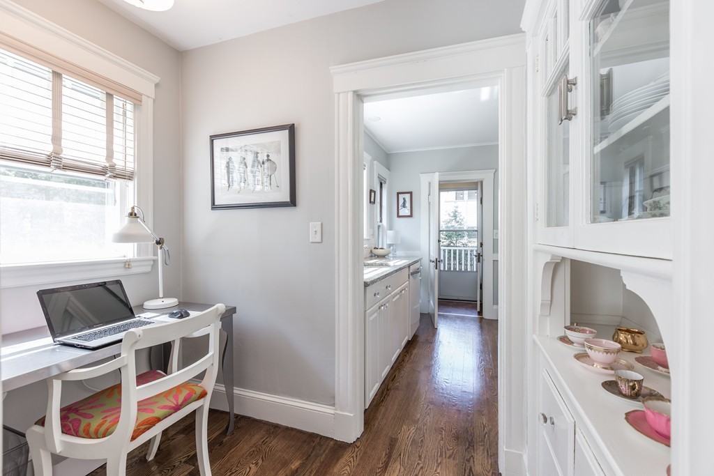 32 Skahan Road, Unit 32 Belmont, MA 02478 - Photo 7 of 18 a kitchen with stainless steel appliances a stove a sink and a refrigerator