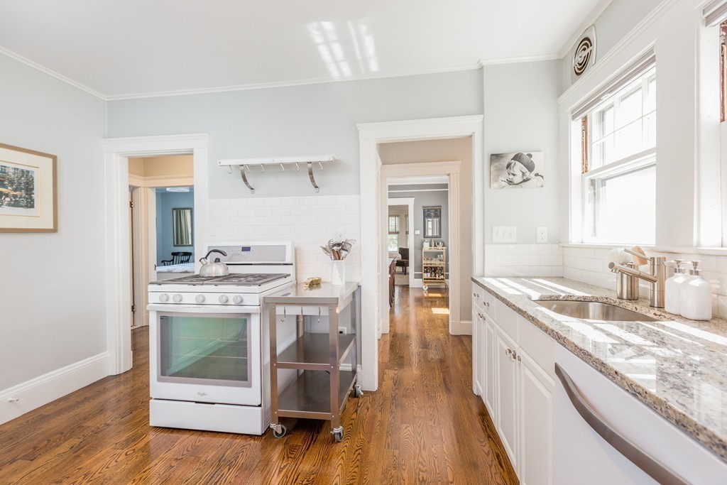 32 Skahan Road, Unit 32 Belmont, MA 02478 - Photo 10 of 18 a kitchen with a sink stove and cabinets
