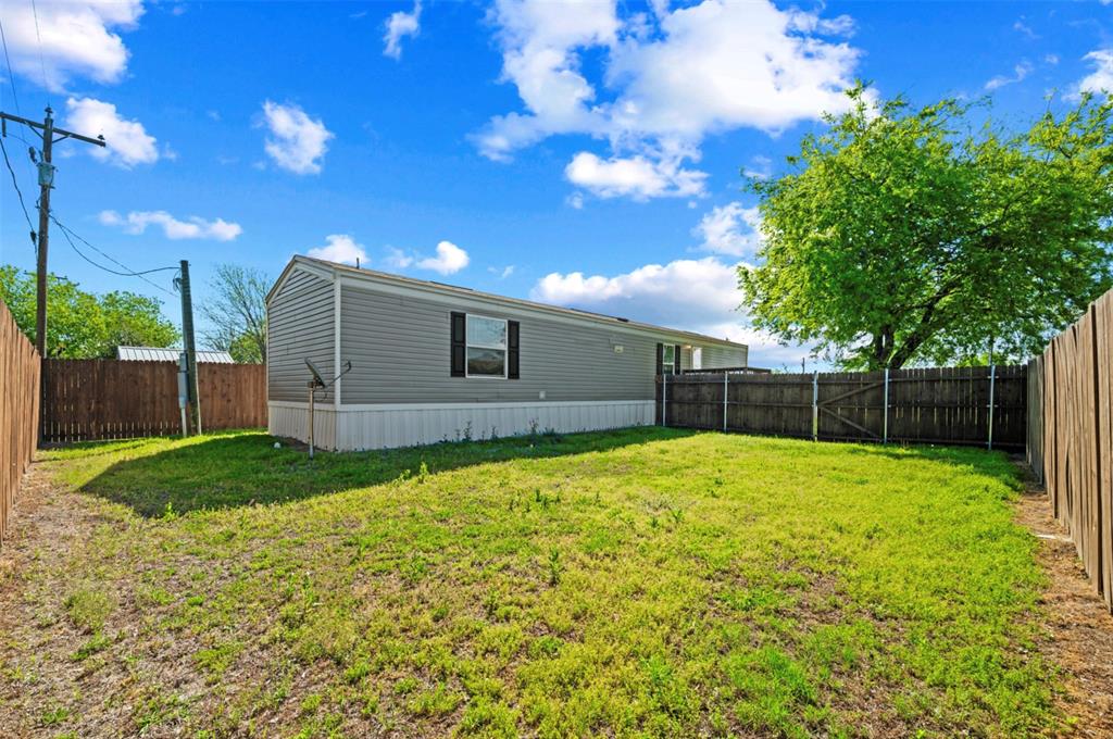 205 Park Street Frost, TX 76641 - Photo 18 of 19 a backyard of a house with lots of green space