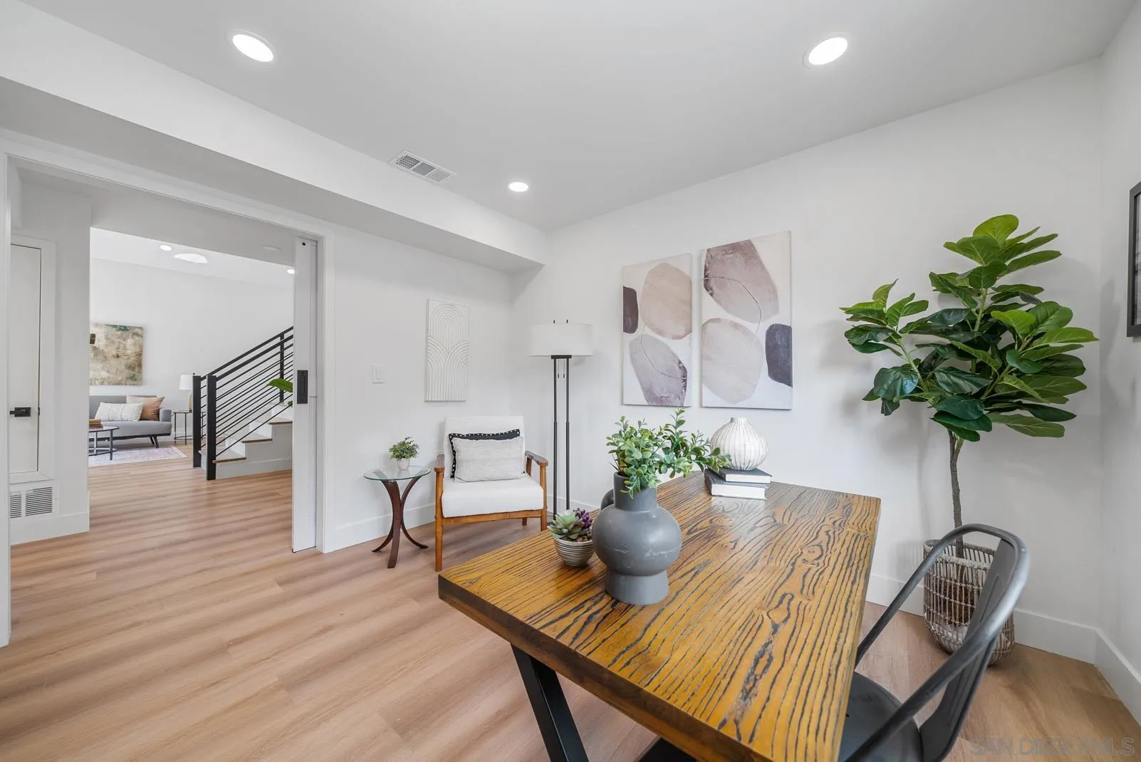 3523 Chauncey Road Oceanside, CA 92056 - Photo 17 of 34 a view of a dining room with furniture and a potted plant