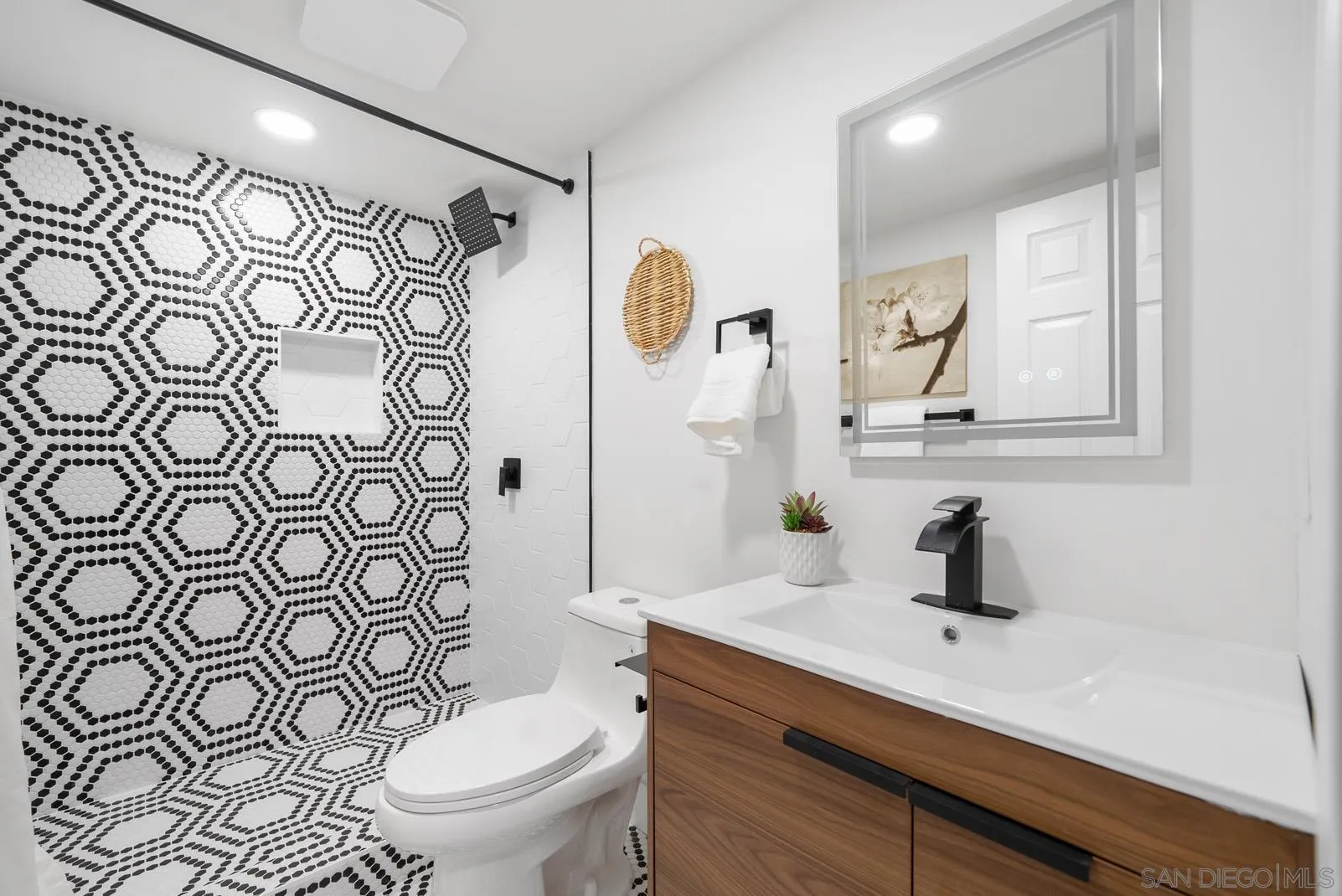 3523 Chauncey Road Oceanside, CA 92056 - Photo 18 of 34 a bathroom with a sink a toilet and shower curtain