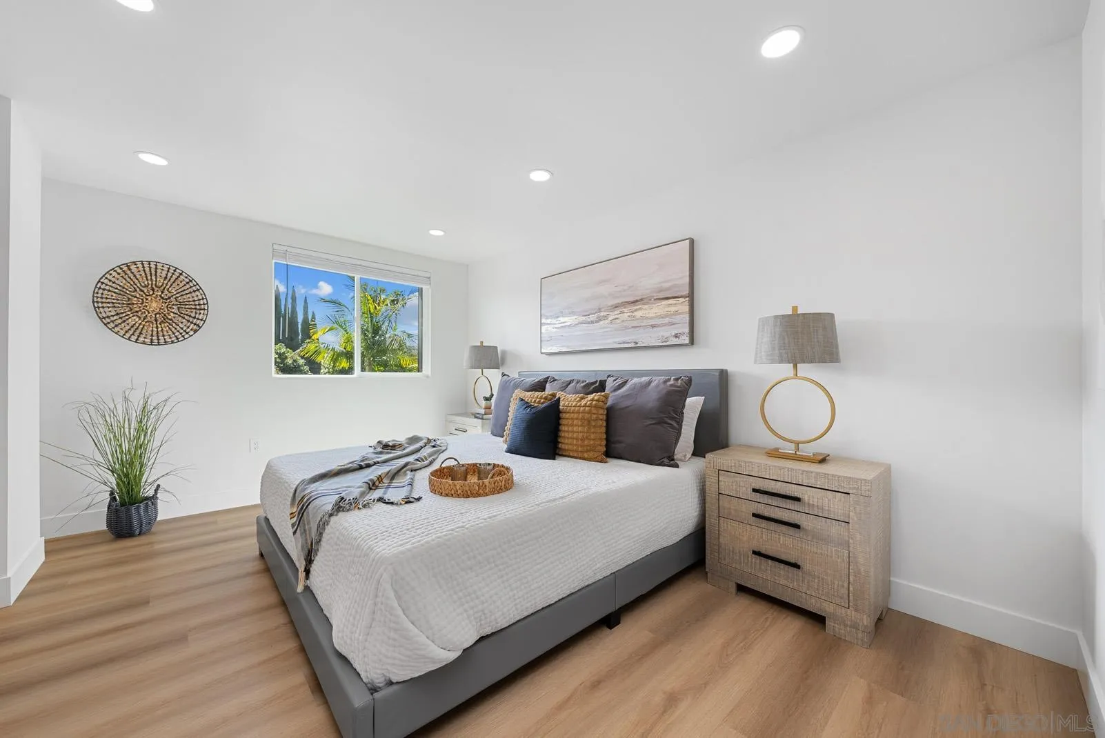 3523 Chauncey Road Oceanside, CA 92056 - Photo 20 of 34 a bedroom with a bed and painting on the wall