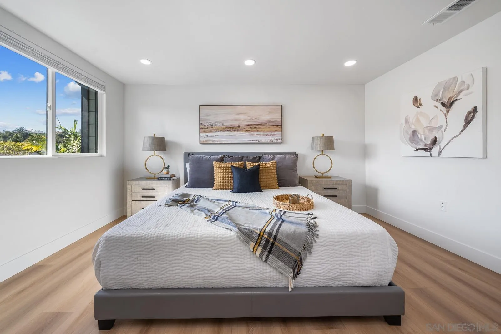 3523 Chauncey Road Oceanside, CA 92056 - Photo 22 of 34 a bedroom with a large bed and a painting on the wall