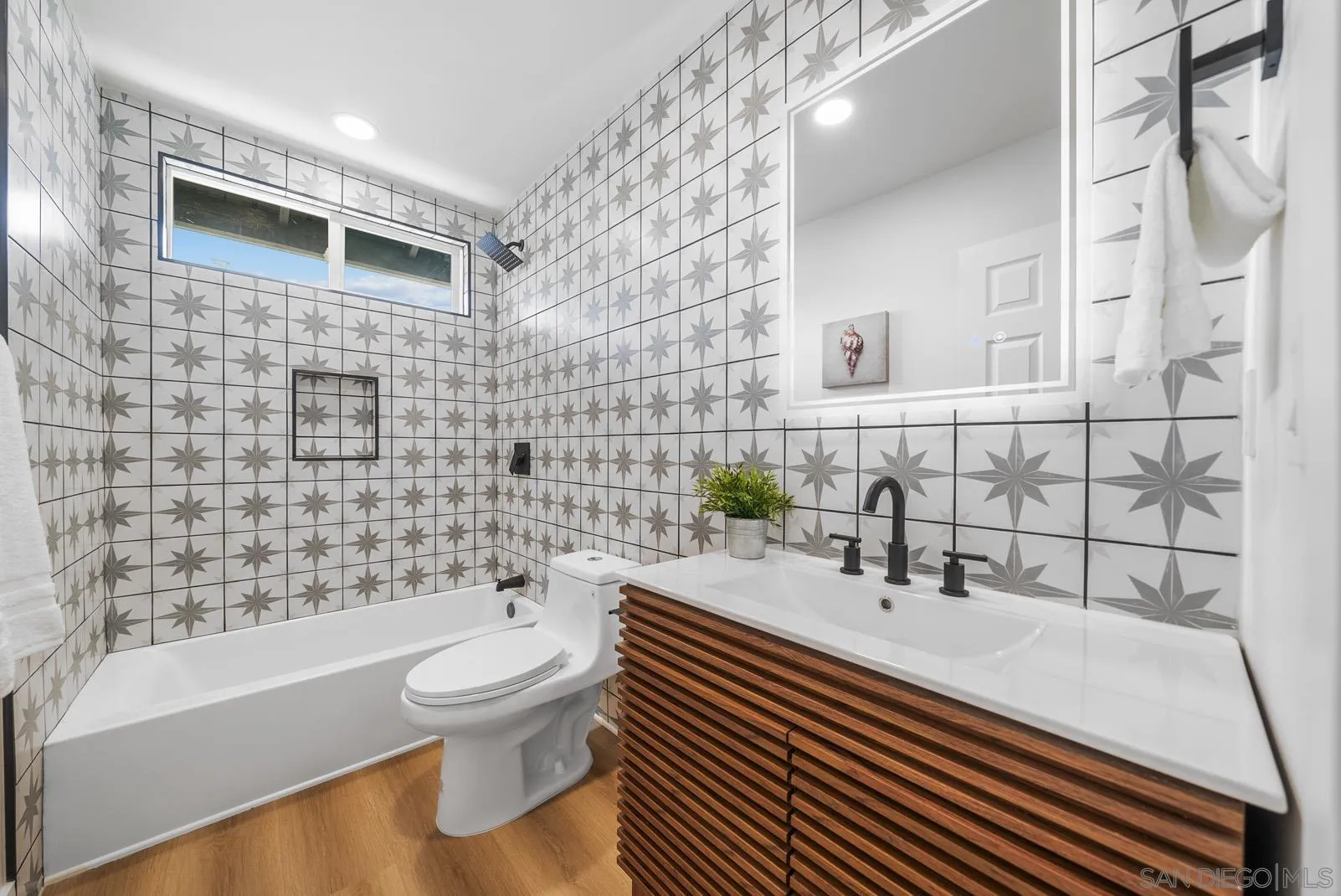 3523 Chauncey Road Oceanside, CA 92056 - Photo 27 of 34 a bathroom with a sink a toilet and shower