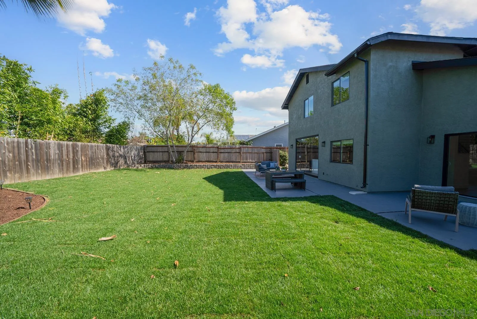 3523 Chauncey Road Oceanside, CA 92056 - Photo 31 of 34 a view of a house with a backyard