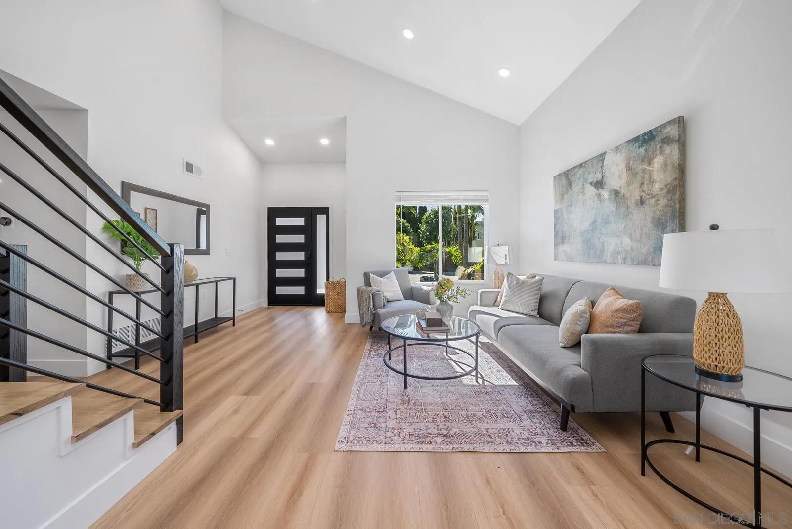 3523 Chauncey Road Oceanside, CA 92056 - Photo 5 of 34 a living room with furniture and a wooden floor
