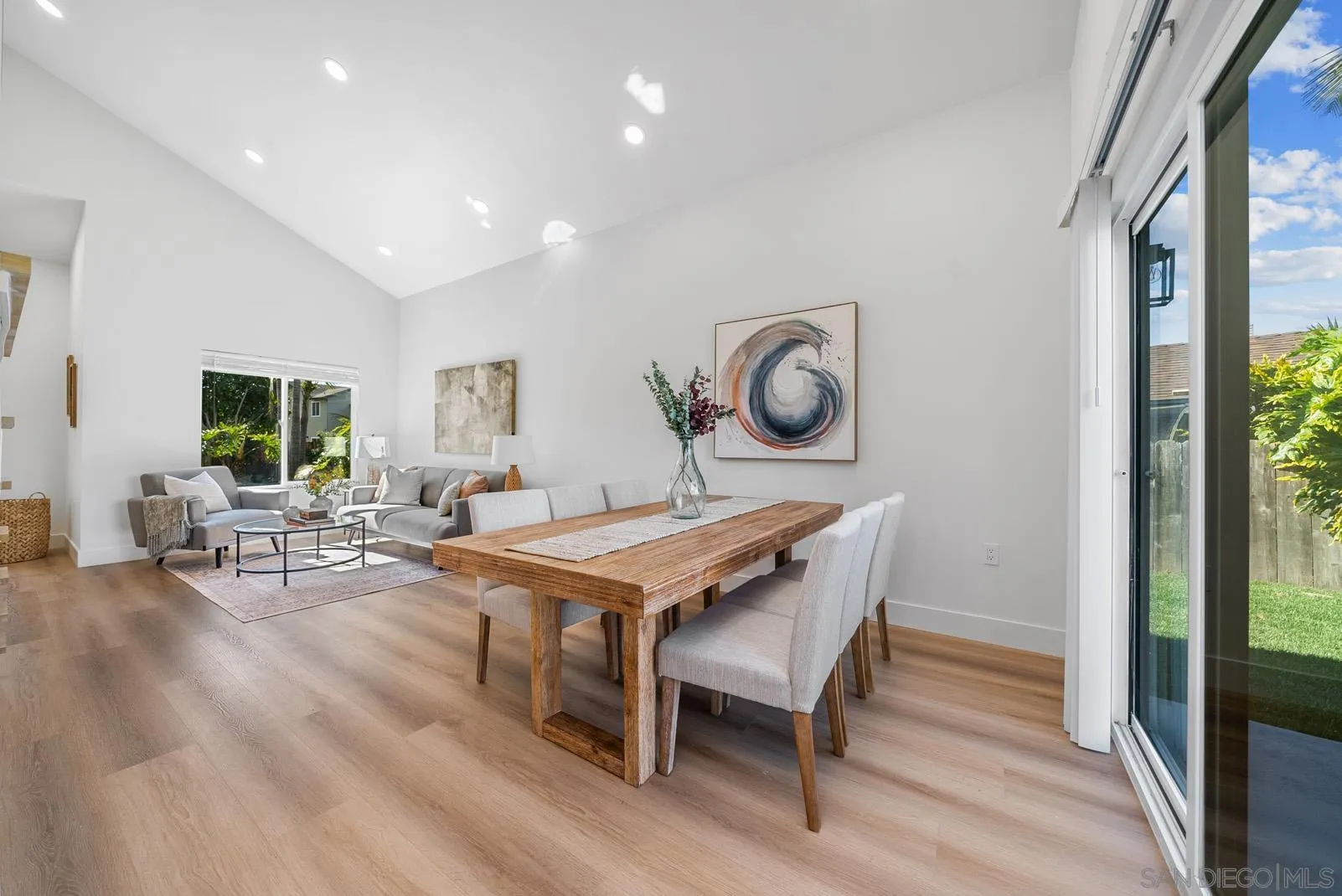 3523 Chauncey Road Oceanside, CA 92056 - Photo 8 of 34 a living room with furniture a rug and a large window