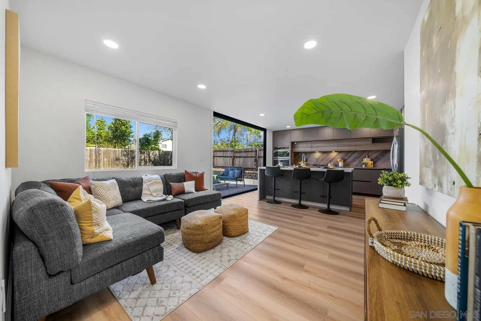 3523 Chauncey Road Oceanside, CA 92056 - Photo 9 of 34 a living room with furniture a fireplace and a flat screen tv