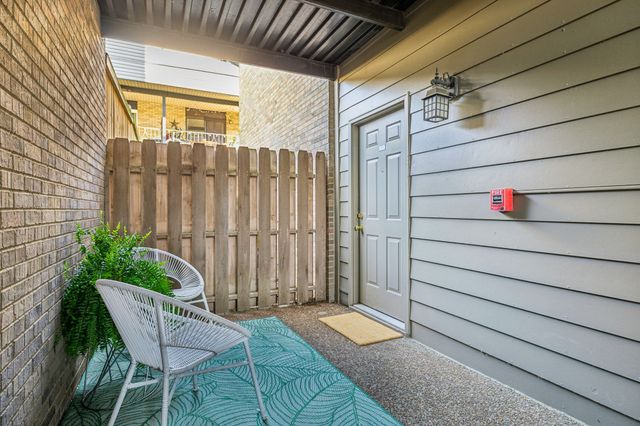 a view of a porch with seating space