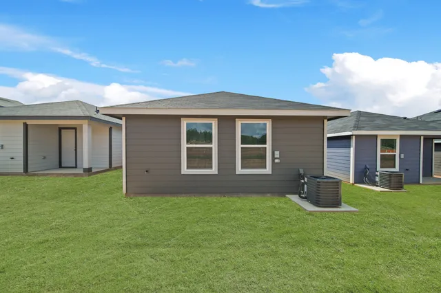 a backyard of a house with large garden