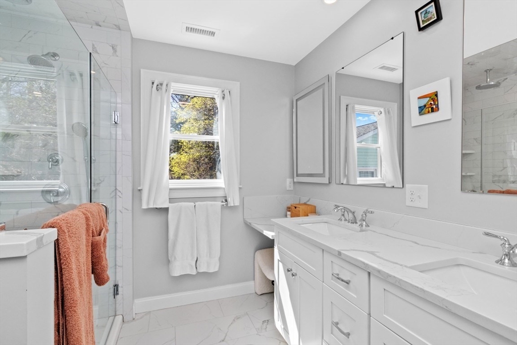 20 College Farm Road Waltham, MA 02451 - Photo 15 of 32 a bathroom with a sink mirror and a bathtub