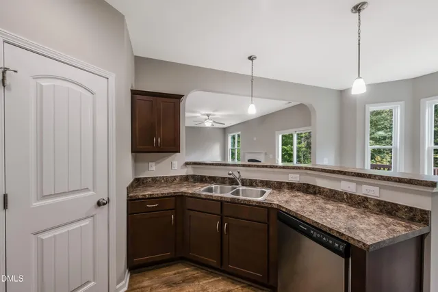 a kitchen with a sink and a refrigerator
