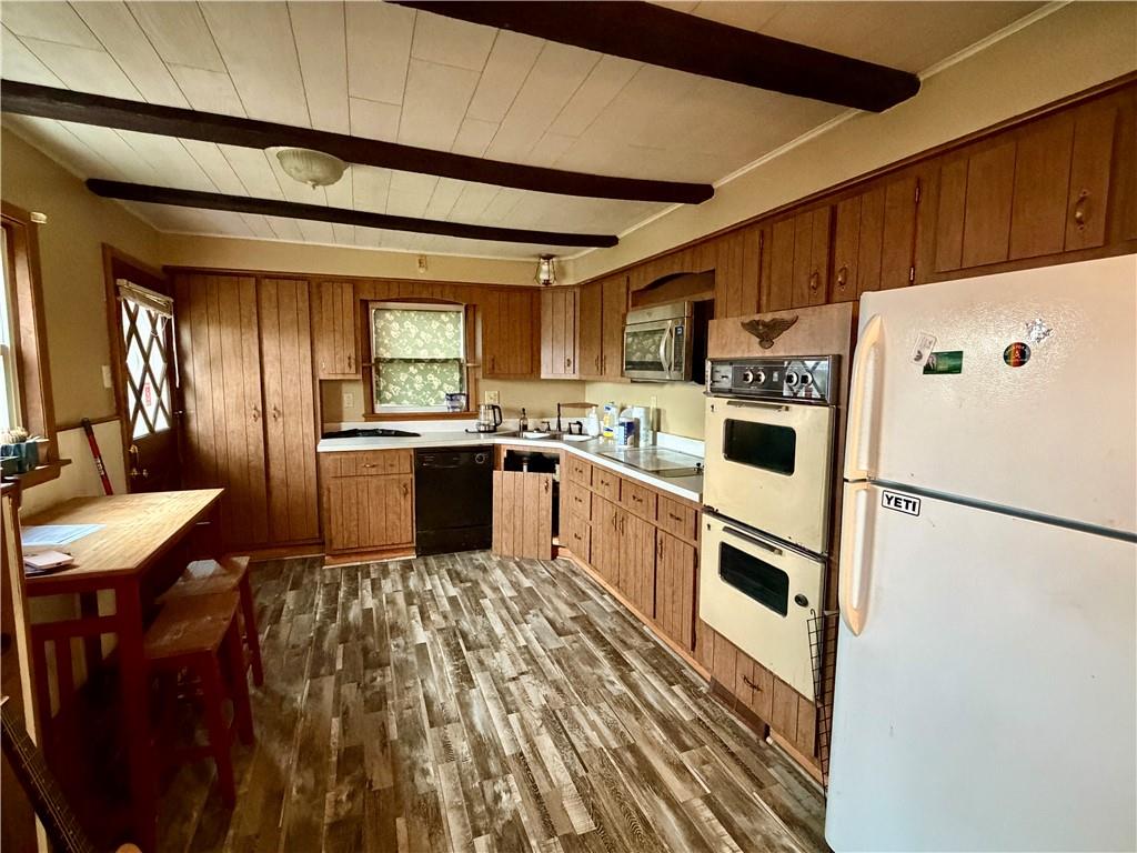 118 Ida Avenue Donora, PA 15033 - Photo 5 of 18 a kitchen with granite countertop appliances a sink and a refrigerator