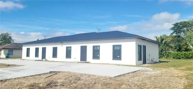 front view of a house with a road