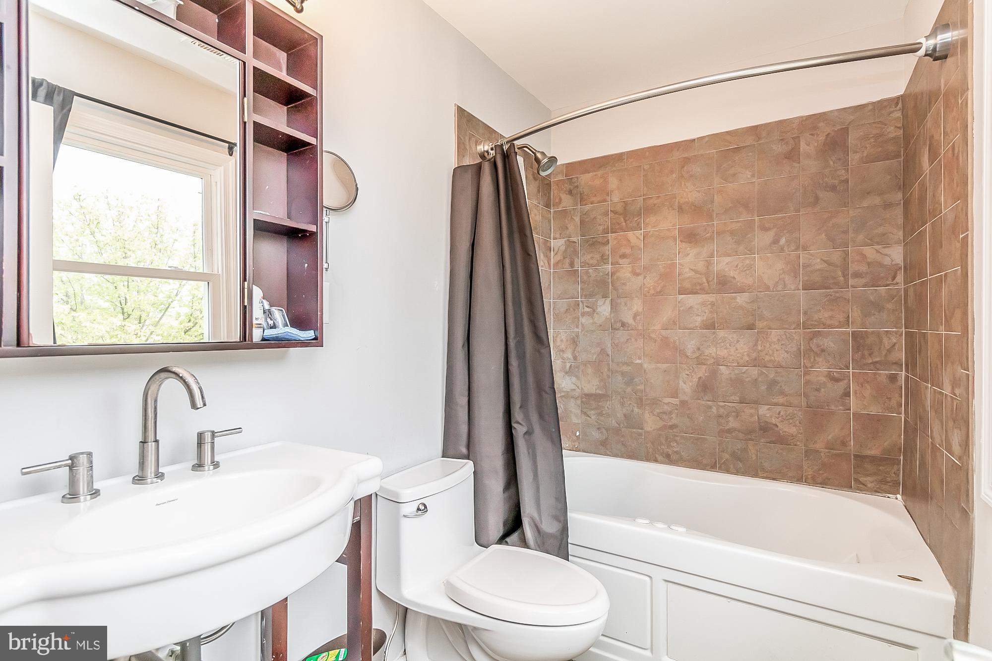 1522 National Rosedale, MD 21237 - Photo 13 of 41 Renovated primary bath with whirlpool soaking tub