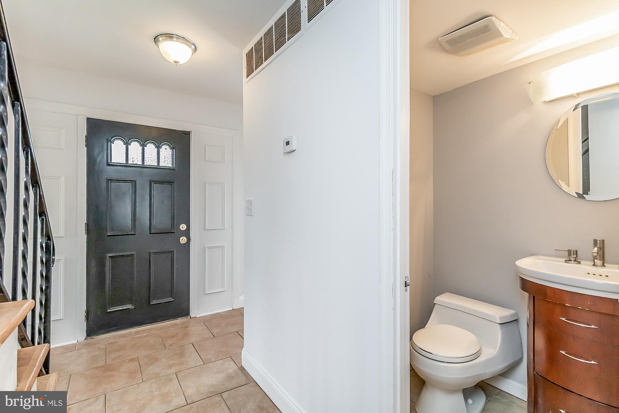 1522 National Rosedale, MD 21237 - Photo 10 of 41 Large foyer and entry level powder room