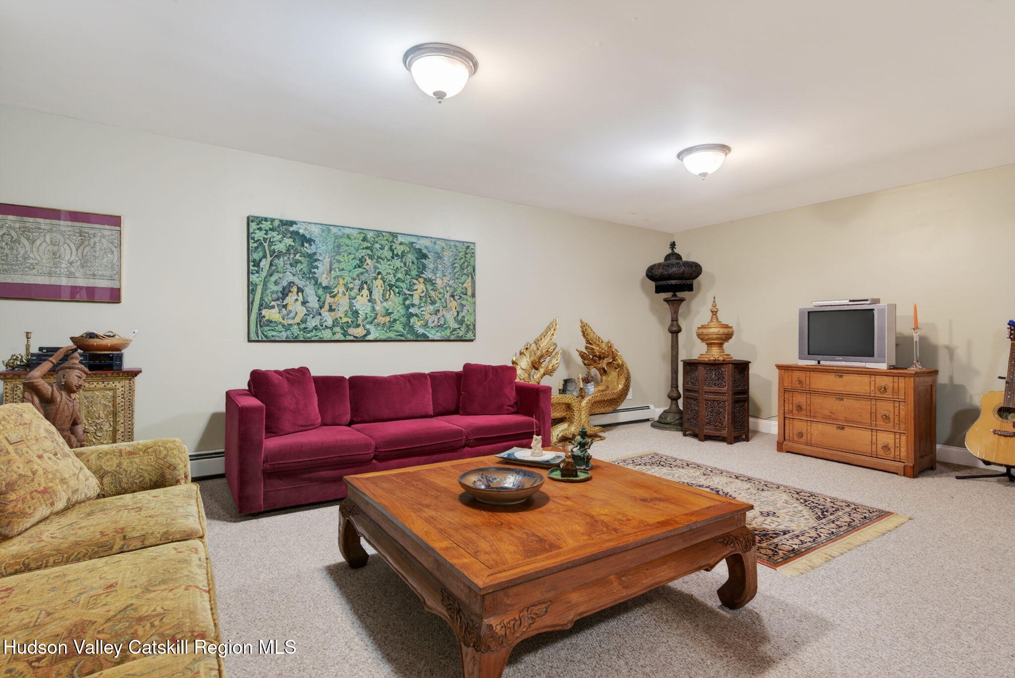 189 Bush Road Stone Ridge, NY 12484 - Photo 29 of 60 a living room with furniture a flat screen tv and a window