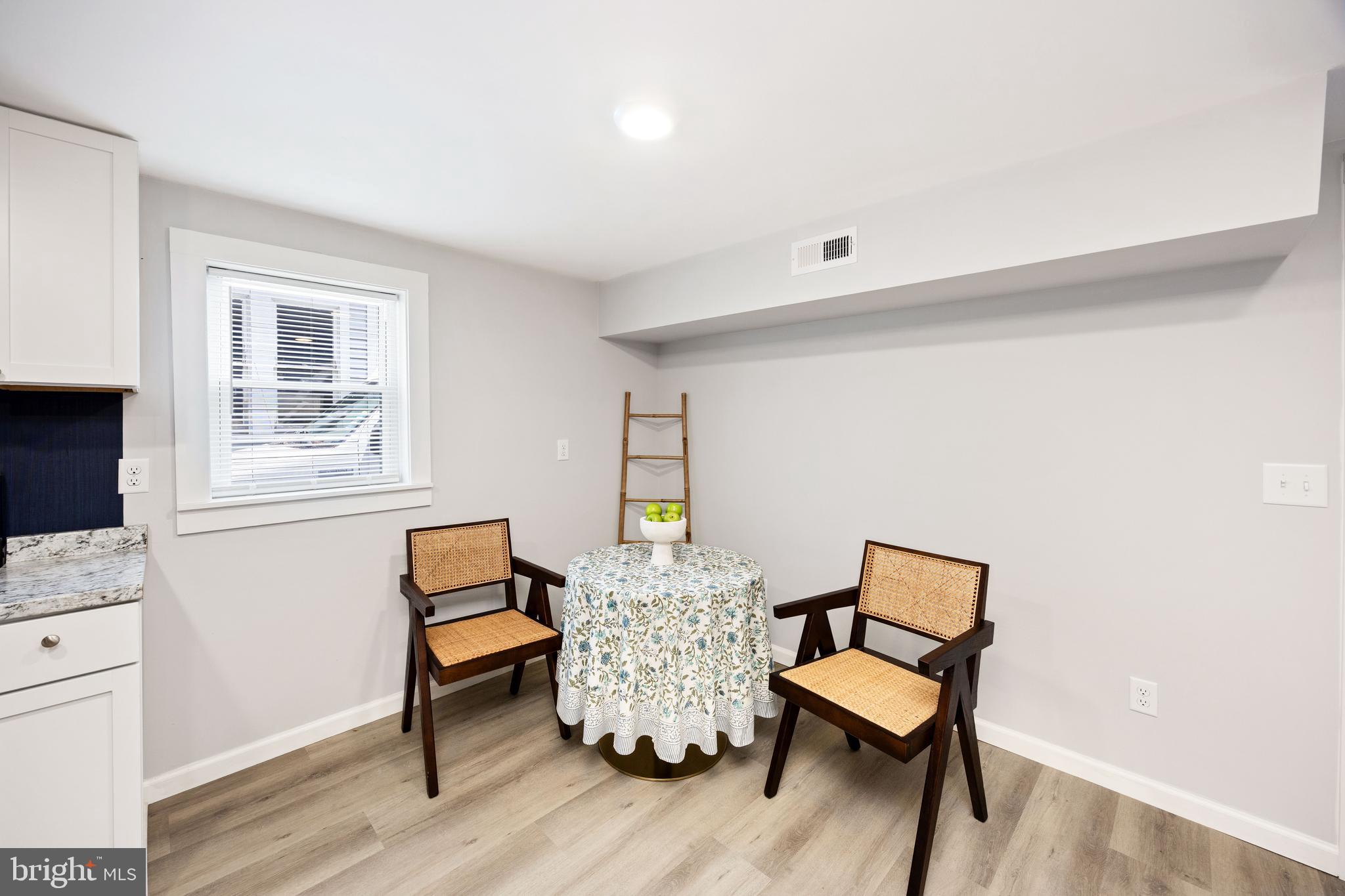 8359 Newark Road Newark, MD 21841 - Photo 21 of 53 a room with furniture and a wooden floor