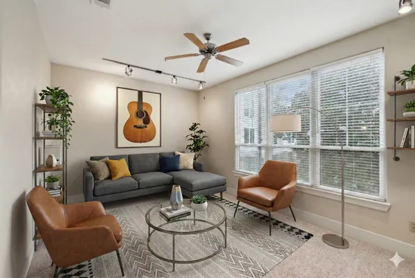 a living room with furniture and a window