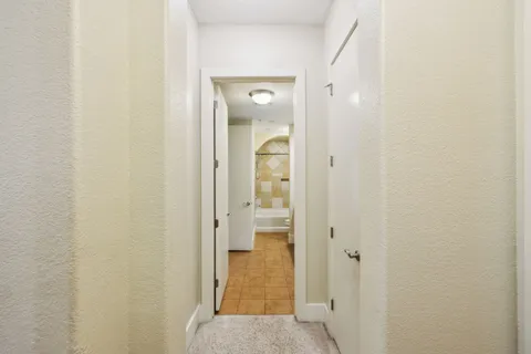 a view of a bathroom from a hallway