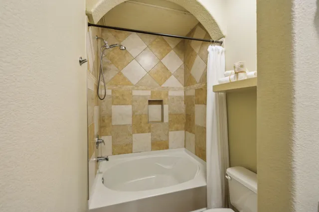 a view of backyard with a garden and outdoor seating