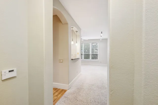 a view of kitchen with a sink and refrigerator