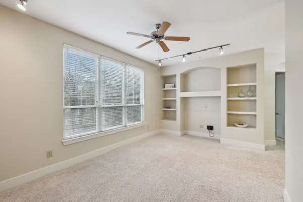 a view of an empty room with a window