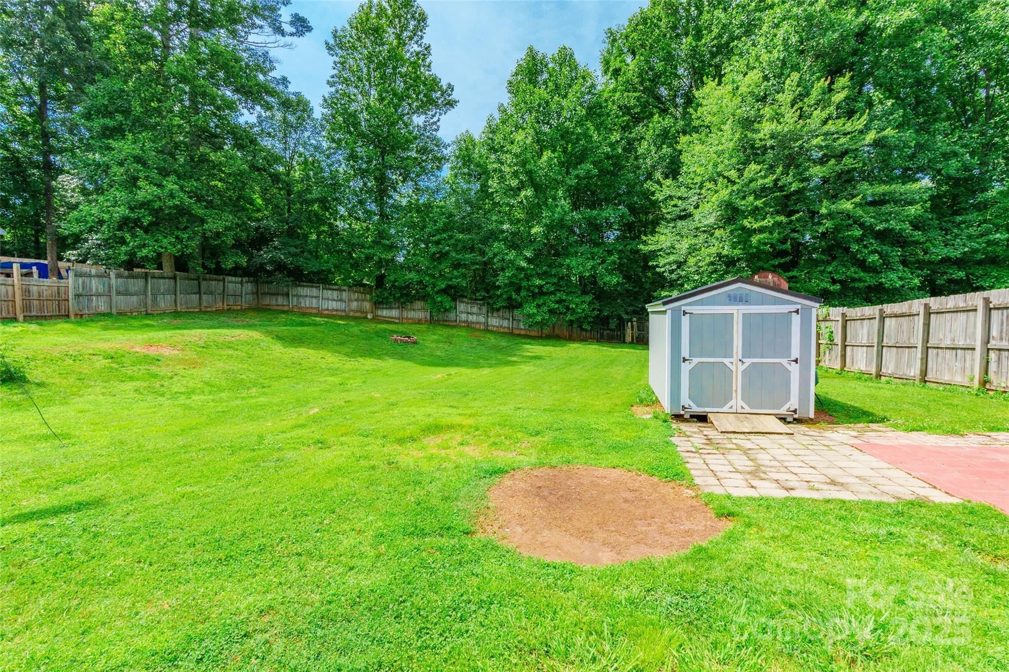 2675 Tablerock Road Lenoir, NC 28645 - Photo 28 of 31 a view of a backyard with a small cabin