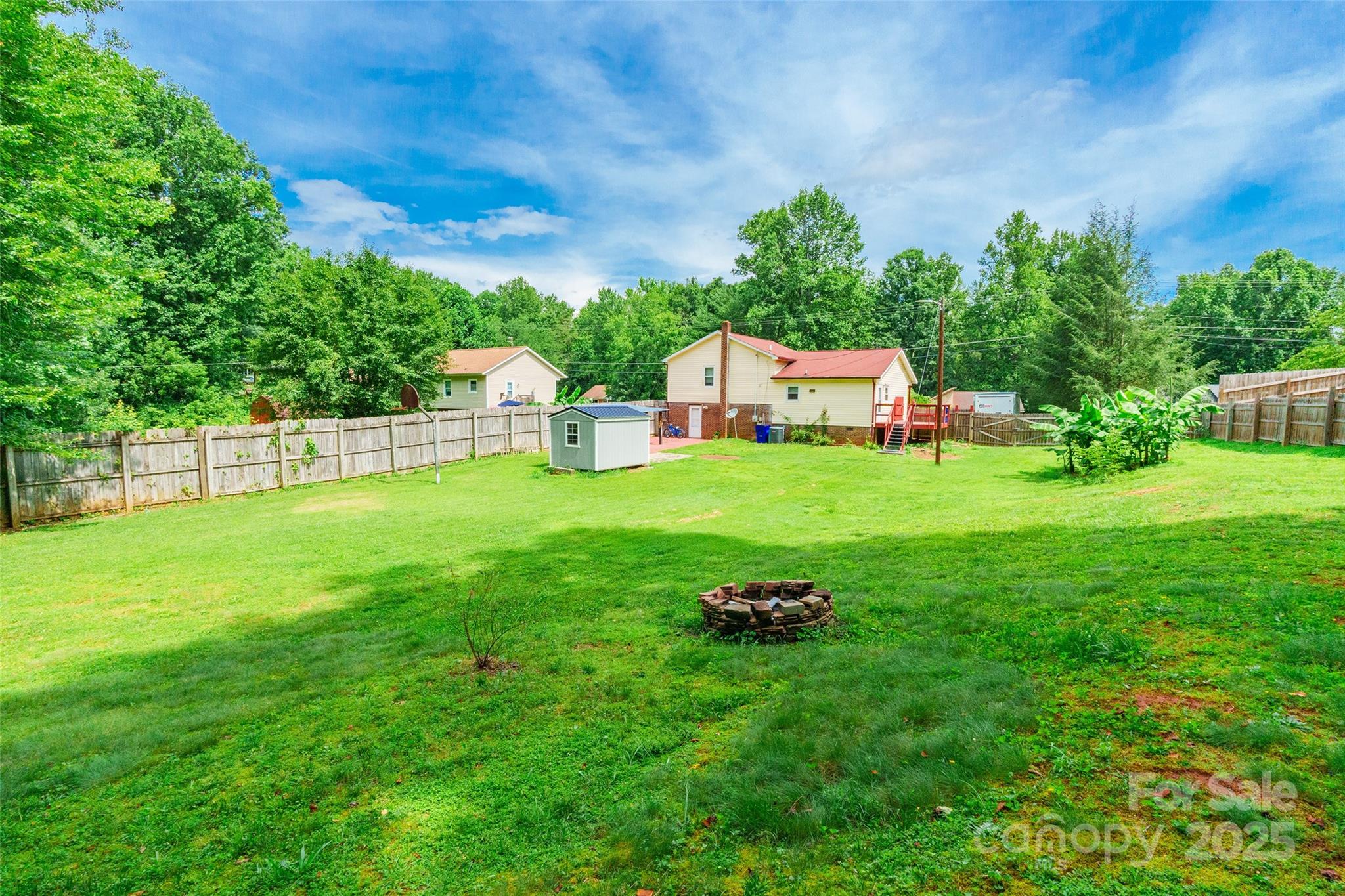 2675 Tablerock Road Lenoir, NC 28645 - Photo 31 of 31 a backyard of a house with table and chairs