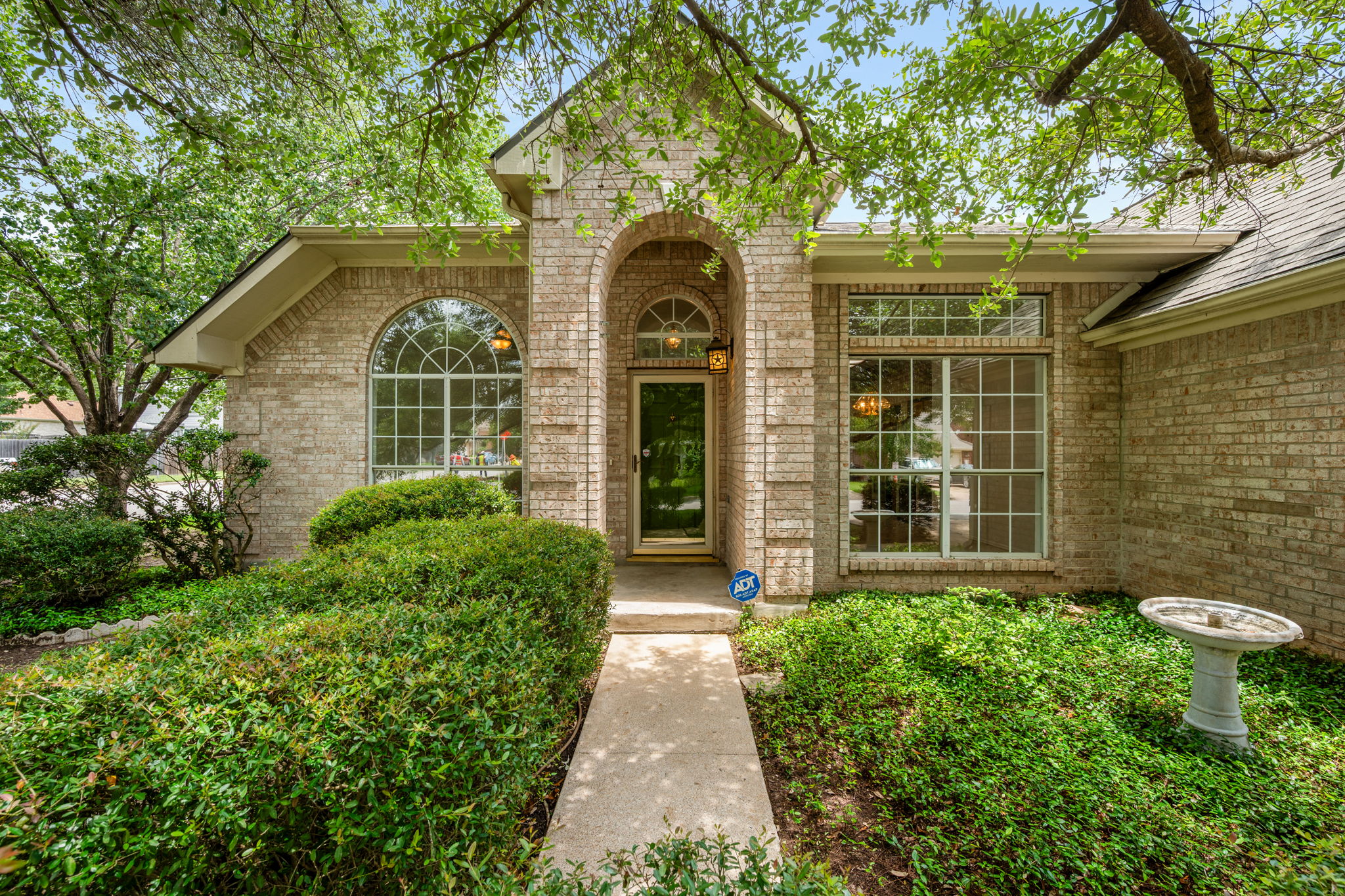 707 Ridge View Drive Leander, TX 78641 - Photo 5 of 40 a front view of a house with a garden