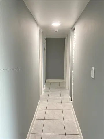 a view of livingroom with an empty space and window