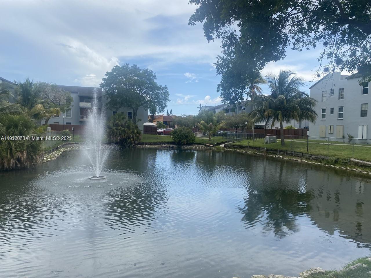 1755 West 60th Street, Unit D304 Hialeah, FL 33012 - Photo 4 of 21 a view of a lake with boats and trees all around