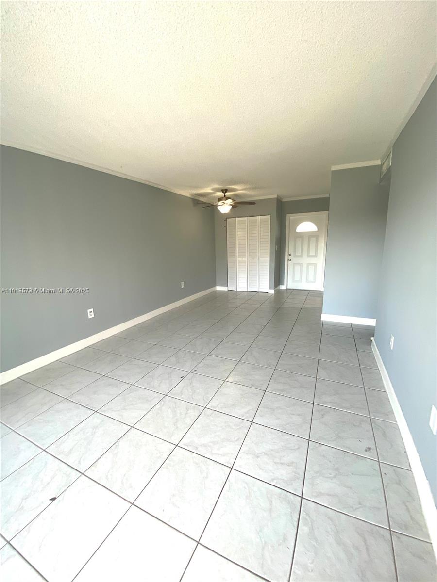 1755 West 60th Street, Unit D304 Hialeah, FL 33012 - Photo 7 of 21 a view of an empty room and window