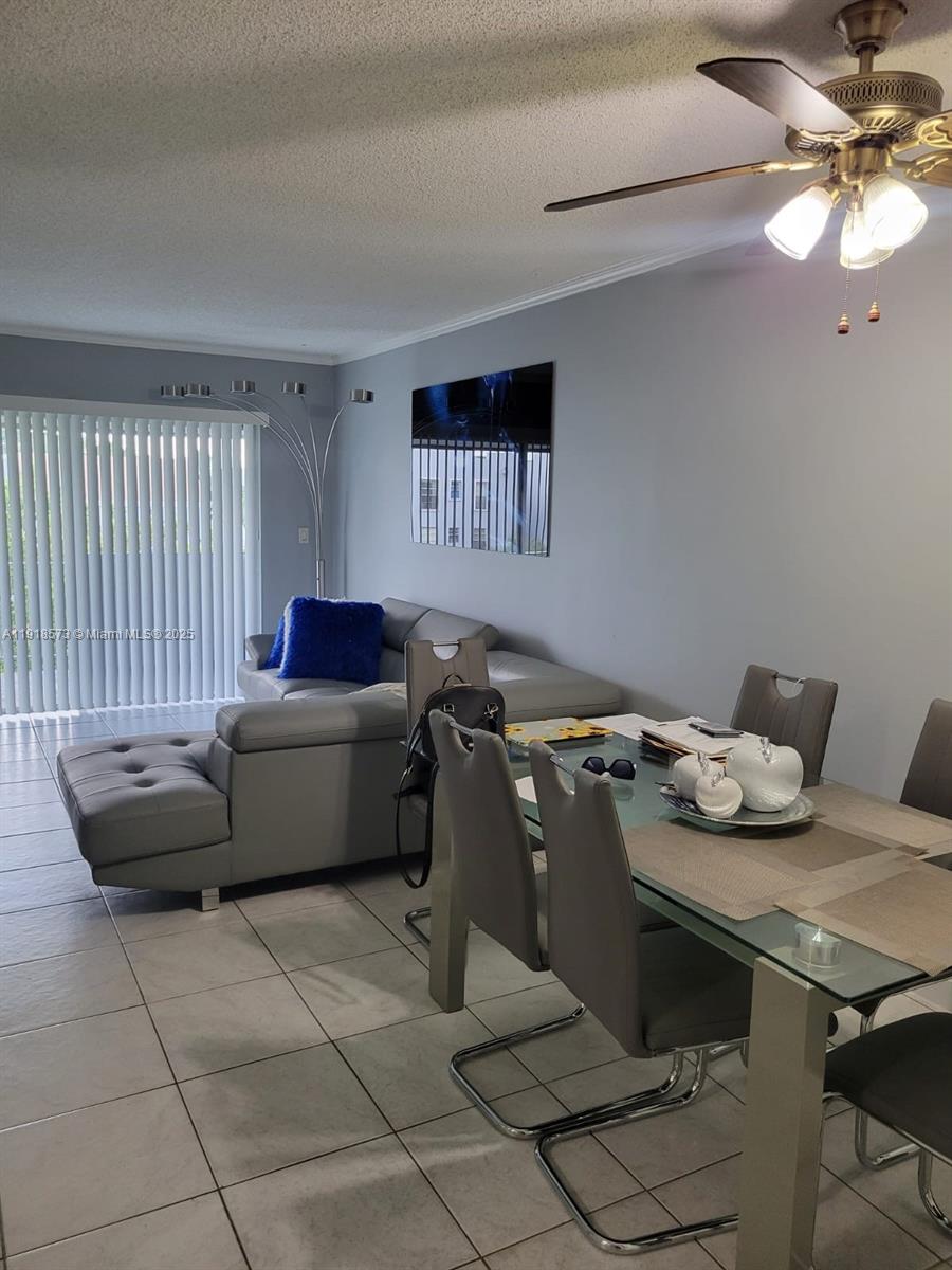 1755 West 60th Street, Unit D304 Hialeah, FL 33012 - Photo 10 of 21 a living room with furniture and a window